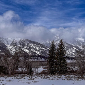 Scenic view of Gran Tetons with clouds covering the peaks