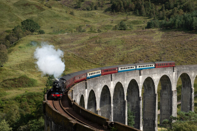 Steam Engine Train Crossing The GlenFinnan Viaduct